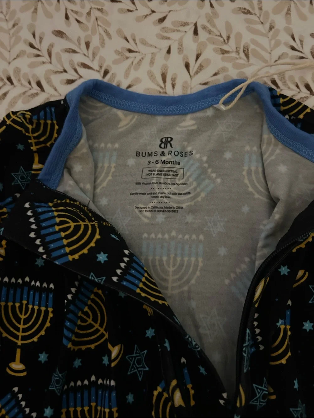 Ruffle Butts Navy & Gold Menorah Footed Pajamas for Kids